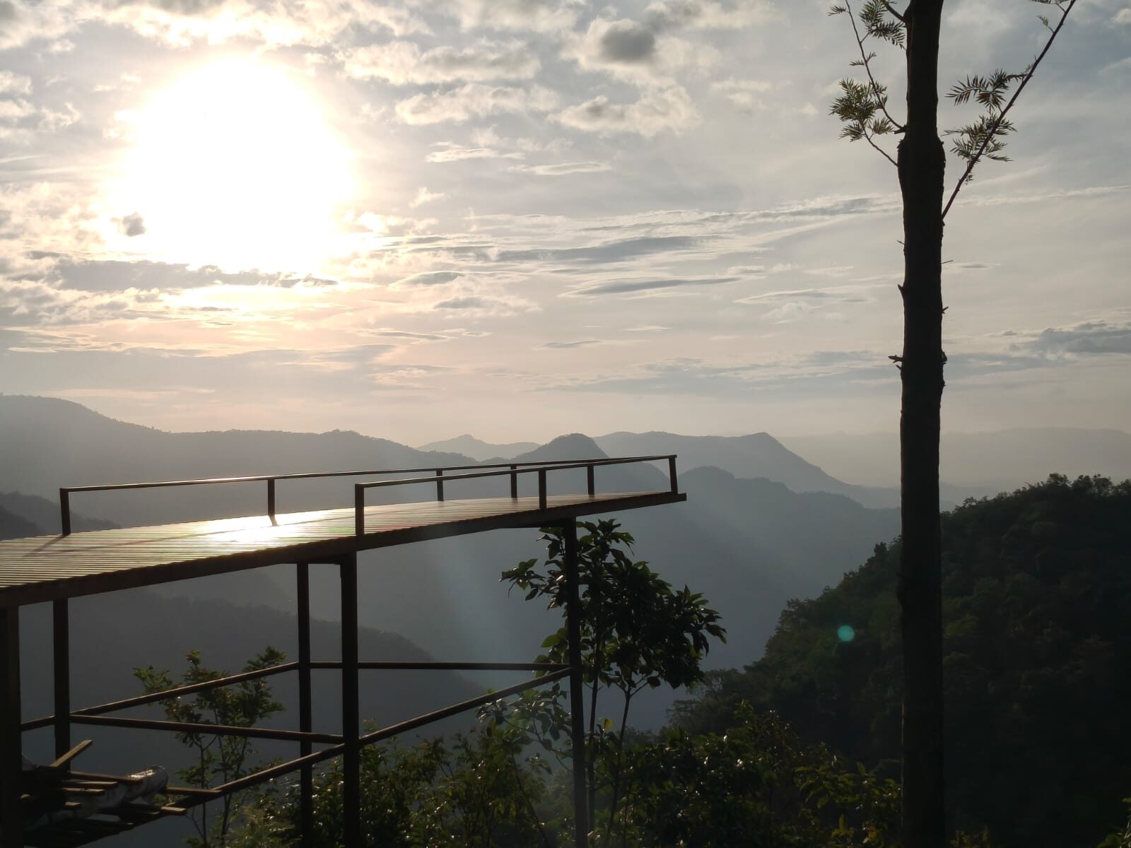 First light over the viewing deck at Old Kodai Camping, with mist filling the valleys below Vellagavi